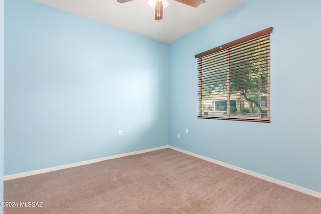 empty room with carpet floors and ceiling fan