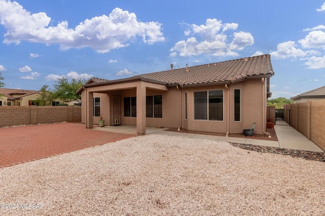 rear view of property featuring a patio