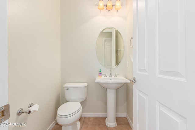 bathroom with tile patterned flooring and toilet