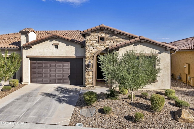 mediterranean / spanish-style house featuring a garage