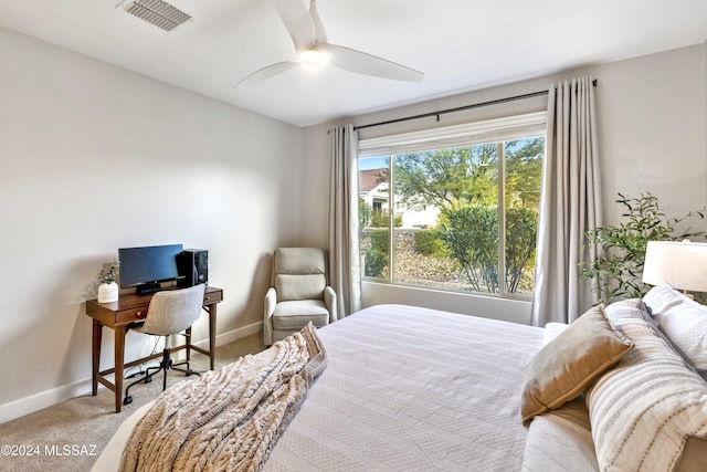 bedroom with ceiling fan and light colored carpet