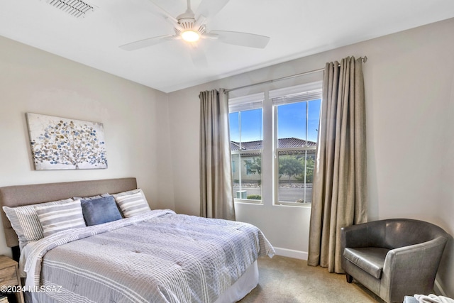 bedroom with light carpet and ceiling fan