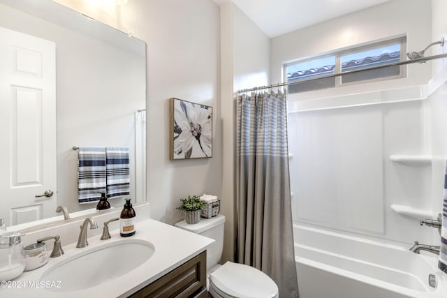 full bathroom featuring toilet, vanity, and shower / tub combo with curtain