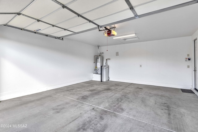 garage featuring water heater and a garage door opener