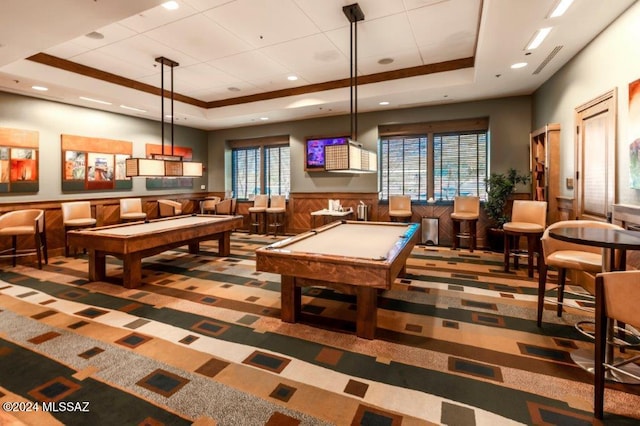 rec room with wood walls, carpet floors, pool table, and a tray ceiling