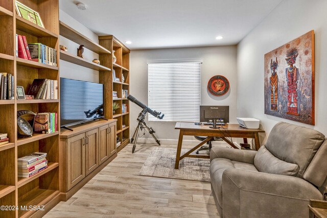 office with light hardwood / wood-style floors