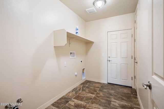 laundry area with hookup for an electric dryer, hookup for a washing machine, and gas dryer hookup