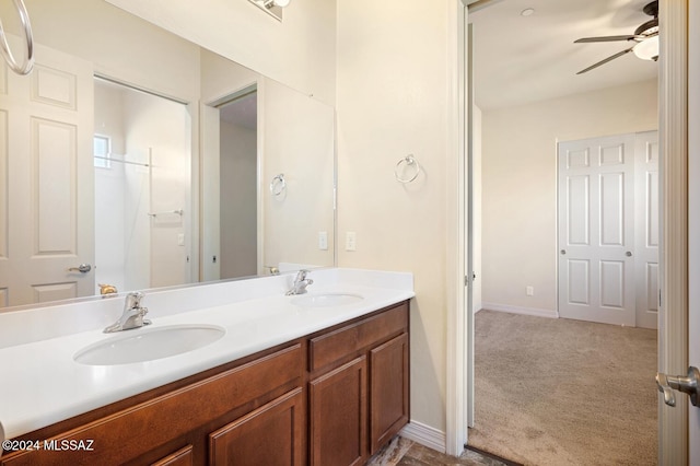 bathroom featuring ceiling fan and vanity