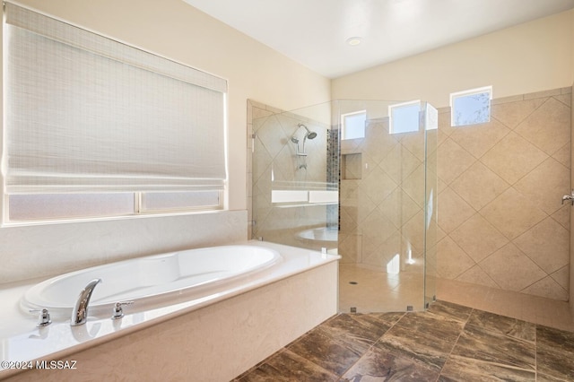 bathroom with shower with separate bathtub