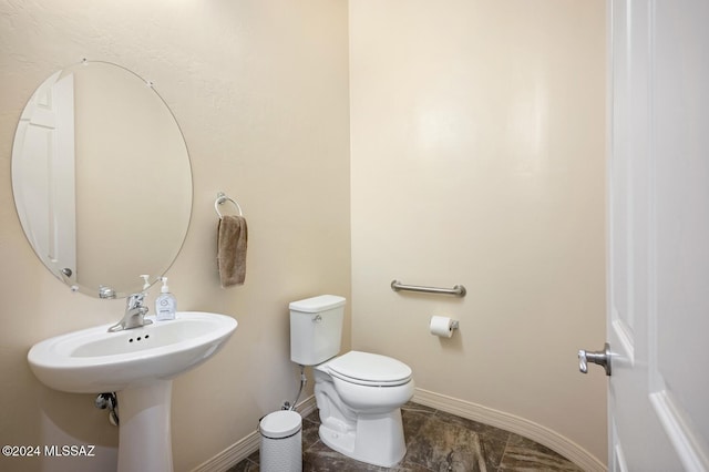 bathroom with toilet and sink