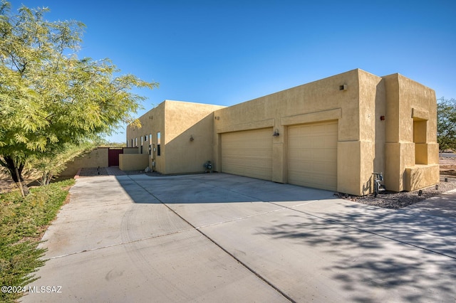 view of side of home featuring a garage