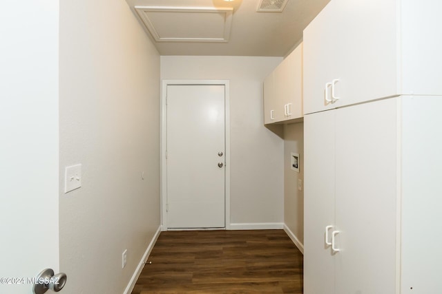 laundry area featuring cabinets, dark hardwood / wood-style floors, and washer hookup