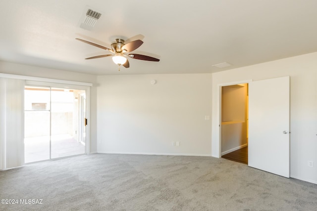 carpeted empty room with ceiling fan