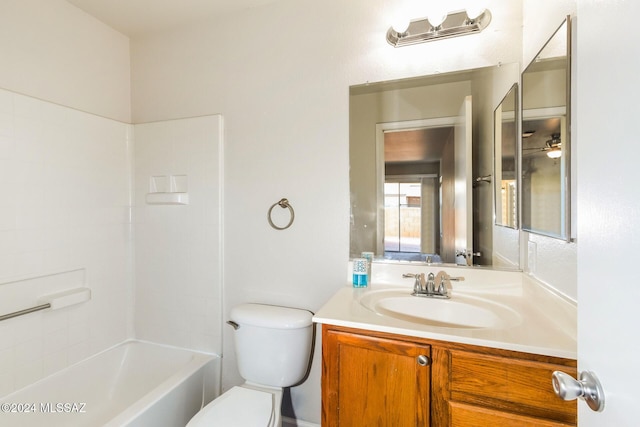 full bathroom with shower / tub combination, vanity, and toilet