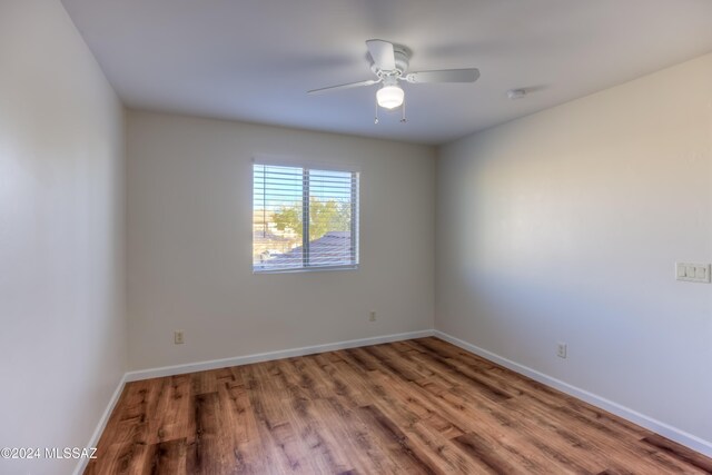 full bathroom with hardwood / wood-style floors, bathing tub / shower combination, toilet, and vanity