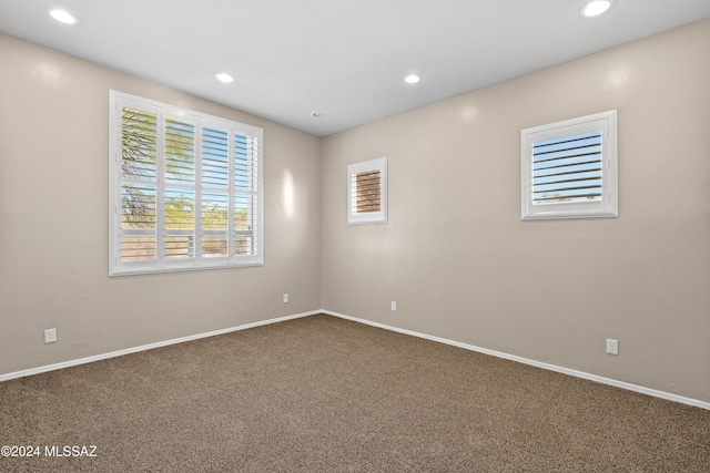 spare room featuring carpet flooring