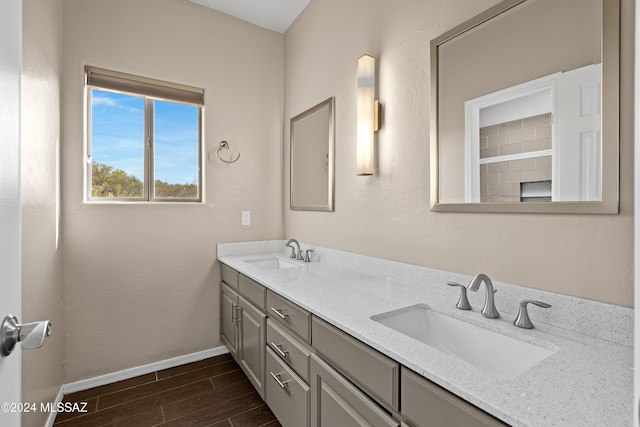 bathroom featuring hardwood / wood-style flooring and vanity