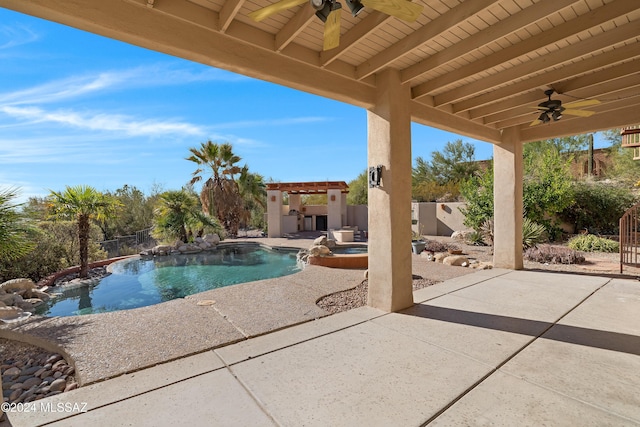 view of pool with ceiling fan, a patio area, and an in ground hot tub