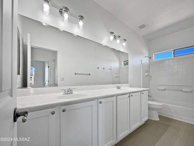 full bathroom featuring shower / bathing tub combination, vanity, toilet, and hardwood / wood-style floors