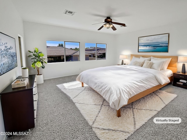 carpeted bedroom featuring ceiling fan