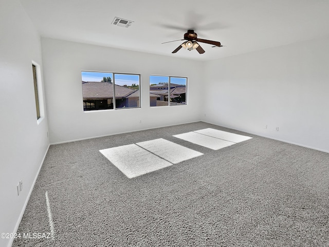 empty room with carpet flooring and ceiling fan