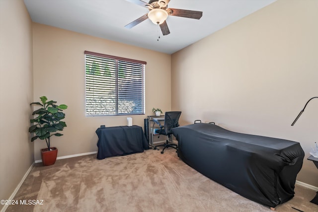 interior space featuring ceiling fan and light colored carpet