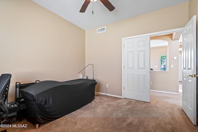 bedroom featuring ceiling fan and light colored carpet