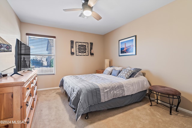 bedroom with light carpet and ceiling fan