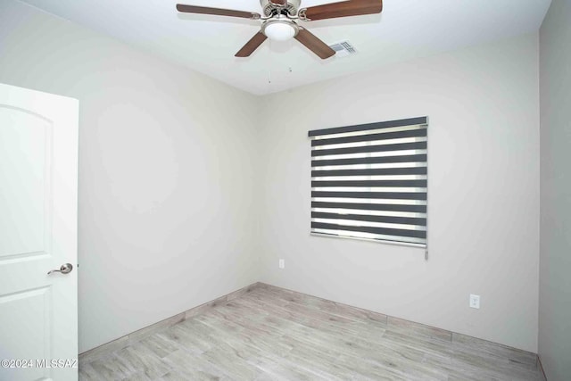 unfurnished room featuring light wood-type flooring and ceiling fan