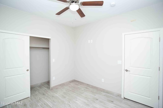 unfurnished bedroom with ceiling fan and light hardwood / wood-style flooring