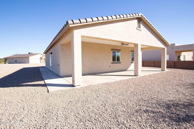 back of property featuring a patio