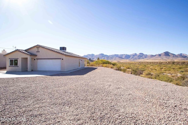 exterior space featuring a mountain view and cooling unit