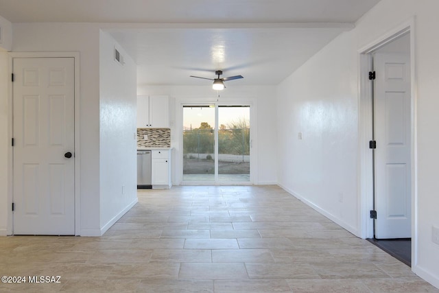 empty room featuring ceiling fan and light tile patterned flooring