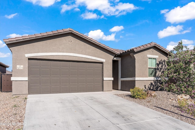 ranch-style home featuring a garage