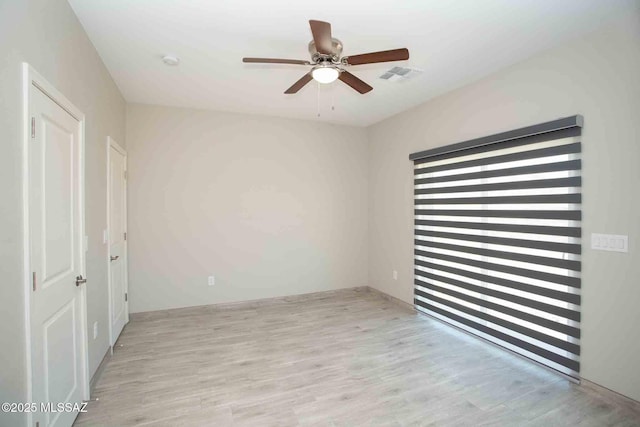 unfurnished bedroom featuring ceiling fan and light wood-type flooring