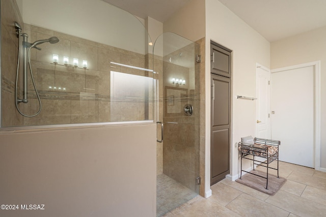 full bathroom with a stall shower and tile patterned flooring