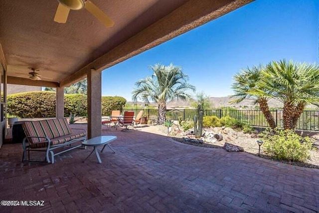 view of patio / terrace with a fenced backyard and ceiling fan