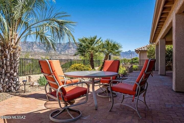view of patio / terrace with outdoor dining space and fence