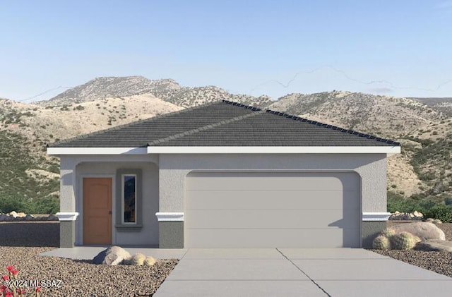 view of front of house with a mountain view and a garage