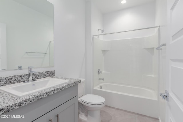 full bathroom with tile patterned floors, vanity, shower / bath combination, and toilet