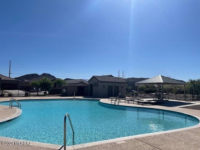 view of pool with a gazebo and a patio