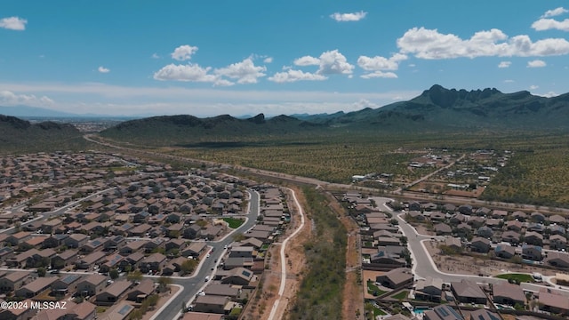 birds eye view of property with a mountain view