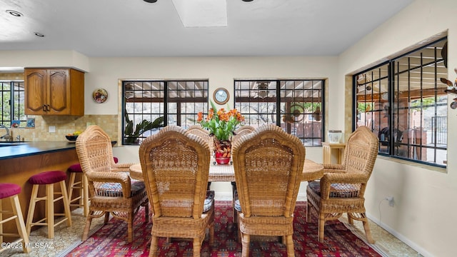 dining room with sink and a healthy amount of sunlight