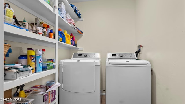 washroom with washing machine and dryer