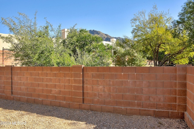 view of gate featuring a mountain view