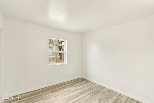 unfurnished room featuring light hardwood / wood-style floors