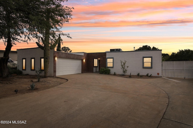 adobe home featuring a garage