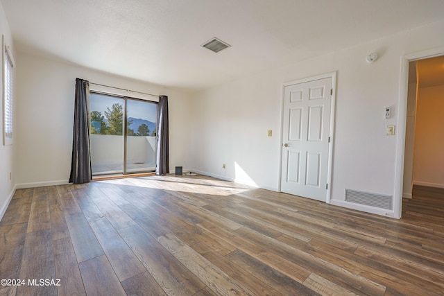 unfurnished room featuring hardwood / wood-style floors