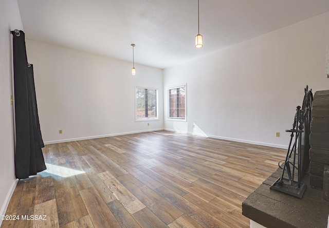 unfurnished living room with wood-type flooring