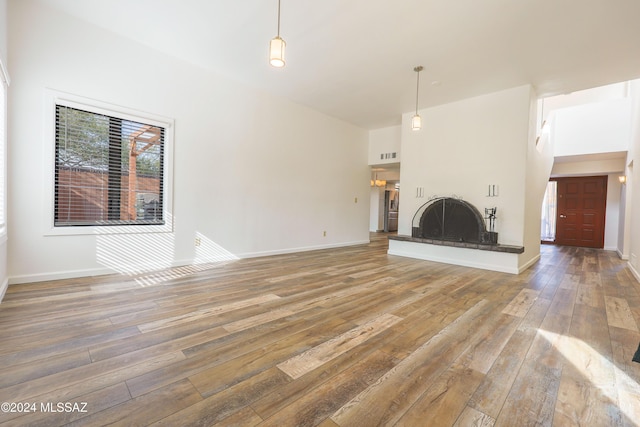 unfurnished living room with hardwood / wood-style flooring